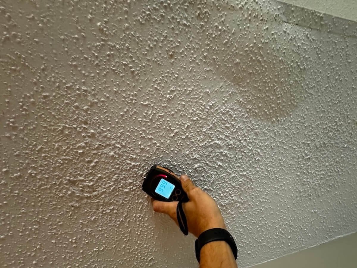 Moisture meter used to determine water damage restoration cost in Hampton Roads.