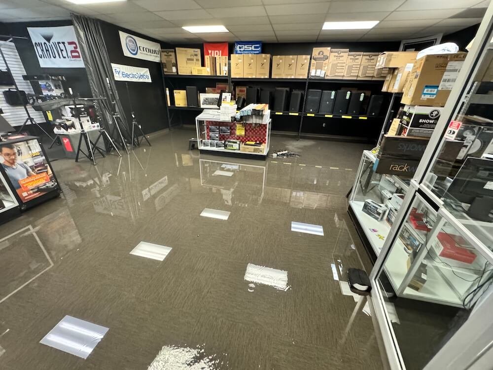 Flooded commercial space requiring emergency water removal in Virginia Beach.